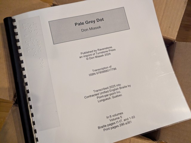 An image of a binder, the cover of which says it is Pale Grey Dot in 6 volumes. Better click the link to see what that's all about!